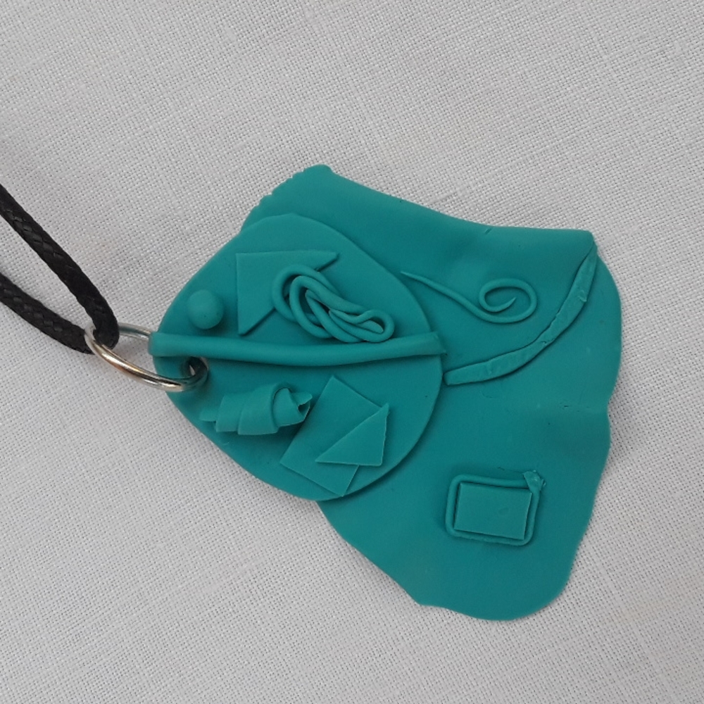 Craft clay pendant necklace.